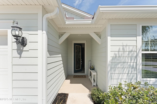 view of exterior entry featuring a garage