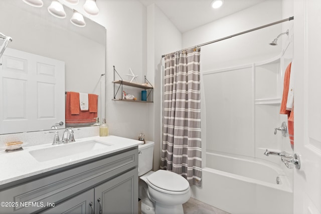 full bath with vanity, shower / bath combo with shower curtain, and toilet