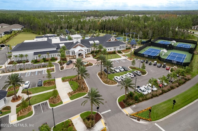 aerial view featuring a wooded view