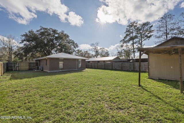 view of yard featuring a fenced backyard