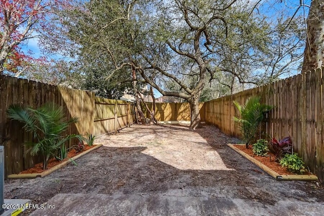 view of yard featuring a fenced backyard