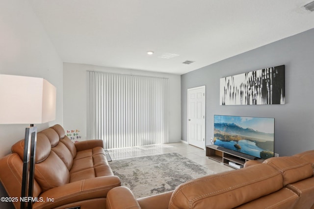 living area with visible vents and tile patterned floors