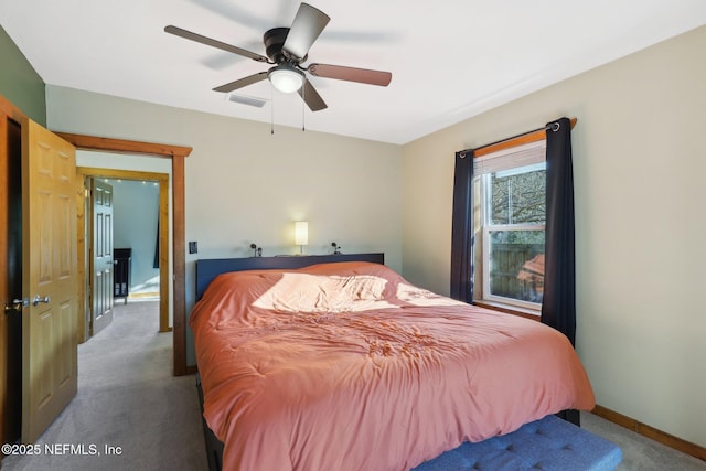 bedroom with visible vents, carpet floors, baseboards, and ceiling fan