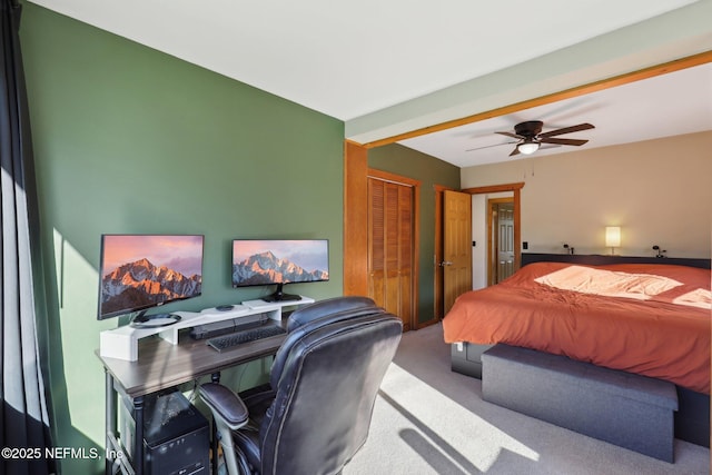 carpeted bedroom with a closet and a ceiling fan