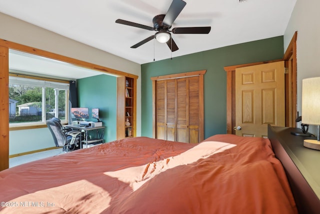 bedroom featuring a closet, baseboards, and a ceiling fan