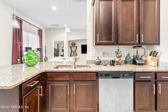 kitchen with light stone counters, visible vents, a sink, dark brown cabinets, and dishwasher