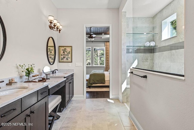 ensuite bathroom featuring a wealth of natural light, double vanity, a sink, and walk in shower