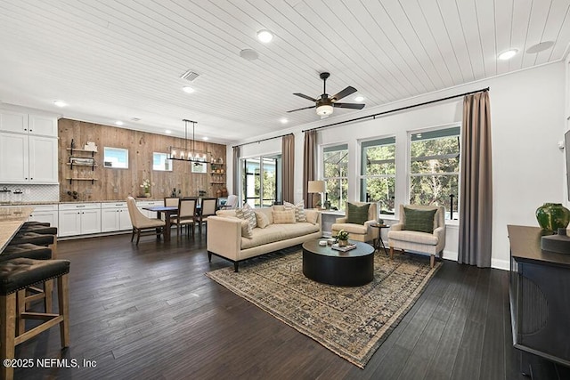 living room featuring dark wood-style flooring, wooden ceiling, visible vents, and recessed lighting