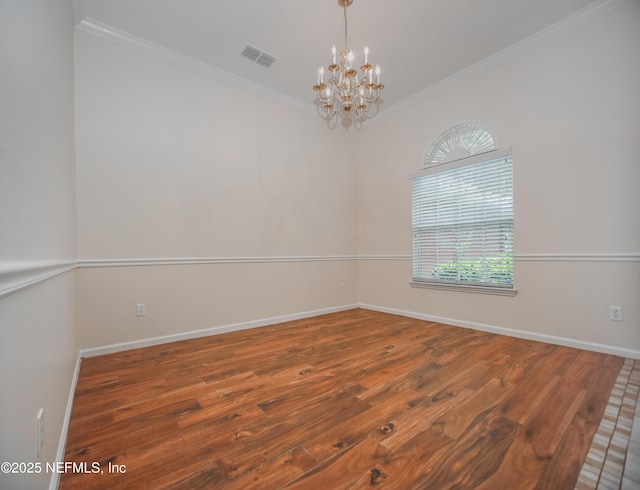 2534 Willow Creek Dr, Fleming Island, FL 32003 - spare room with ornamental molding, a chandelier, and wood finished floors