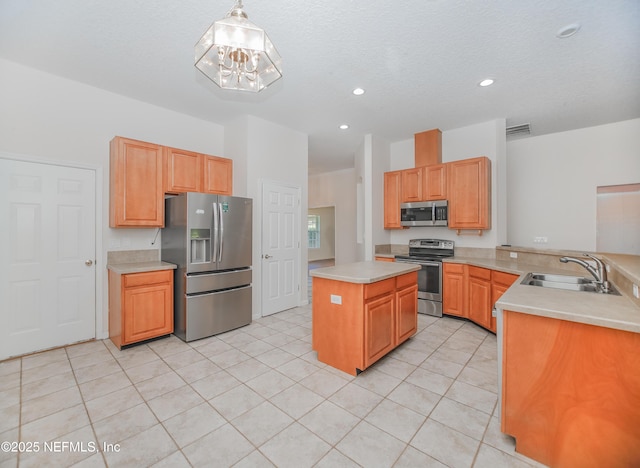 2534 Willow Creek Dr, Fleming Island, FL 32003 - kitchen featuring stainless steel appliances, a peninsula, light countertops, light tile patterned flooring, and a chandelier
