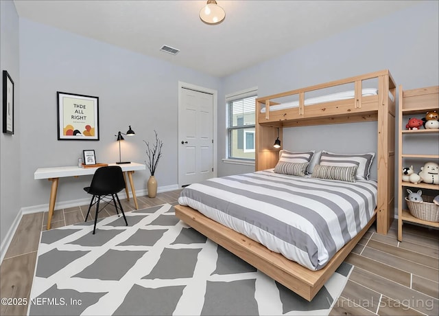 2534 Willow Creek Dr, Fleming Island, FL 32003 - bedroom featuring wood finished floors and baseboards