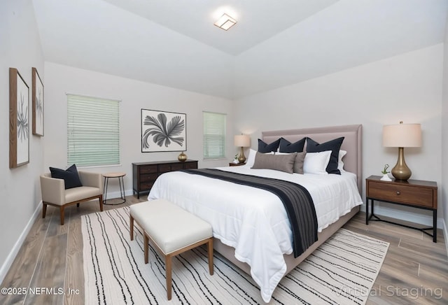 2534 Willow Creek Dr, Fleming Island, FL 32003 - bedroom featuring baseboards and light wood finished floors