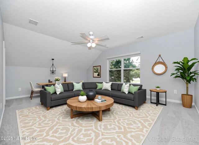2534 Willow Creek Dr, Fleming Island, FL 32003 - living area with carpet flooring, a ceiling fan, and lofted ceiling