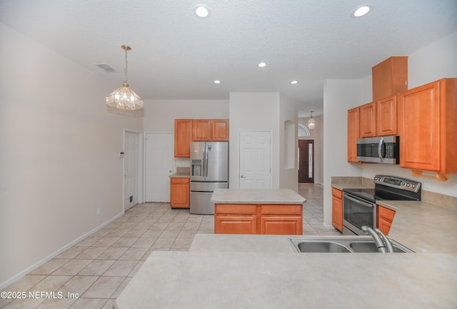 2534 Willow Creek Dr, Fleming Island, FL 32003 - kitchen with appliances with stainless steel finishes, recessed lighting, light tile patterned floors, light countertops, and hanging light fixtures