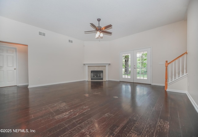 2534 Willow Creek Dr, Fleming Island, FL 32003 - unfurnished living room featuring a ceiling fan, hardwood / wood-style flooring, a premium fireplace, and stairs
