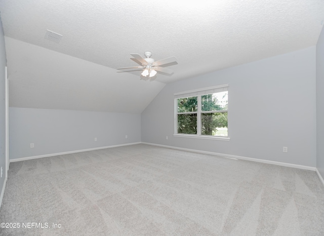 2534 Willow Creek Dr, Fleming Island, FL 32003 - additional living space with a ceiling fan, carpet floors, lofted ceiling, and a textured ceiling