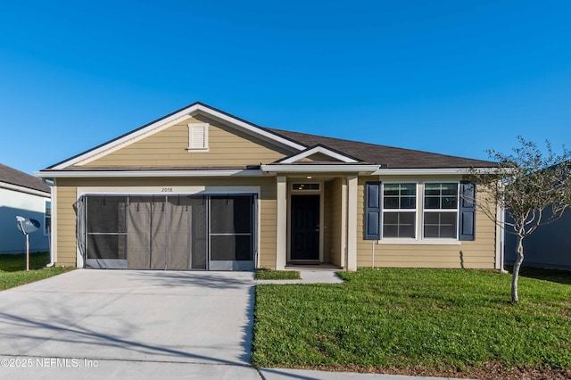 view of front of property featuring a garage, concrete driveway, and a front yard