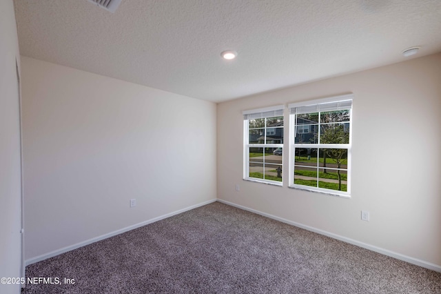 unfurnished room featuring a textured ceiling, recessed lighting, carpet flooring, and baseboards