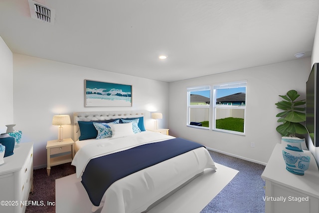 bedroom with dark colored carpet, visible vents, baseboards, and recessed lighting