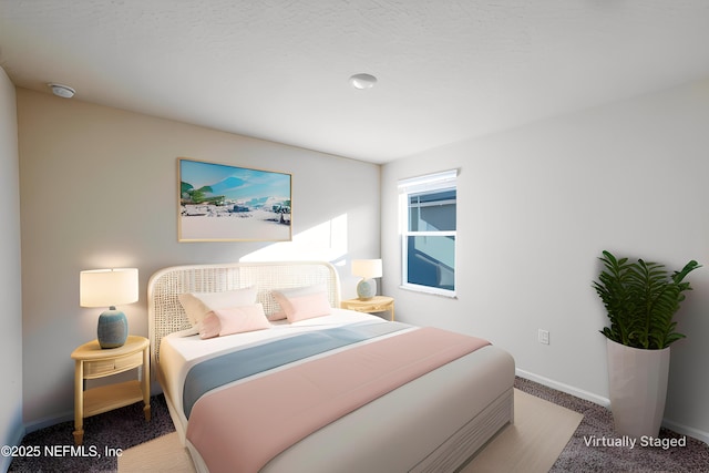 bedroom featuring carpet and baseboards