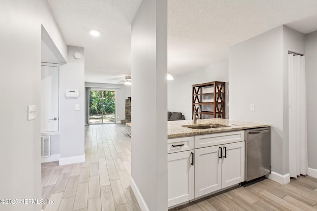 bar with a sink, visible vents, stainless steel dishwasher, and wood finish floors