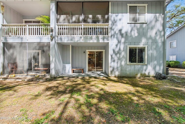 rear view of house with a lawn