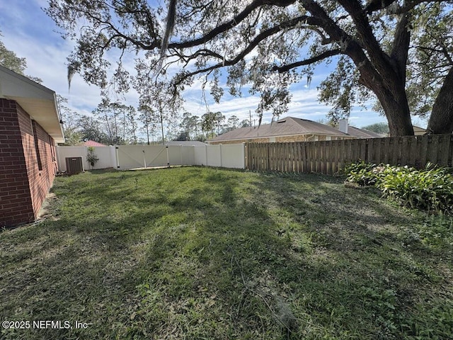 view of yard with cooling unit and a fenced backyard