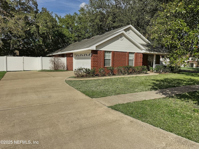 ranch-style home featuring brick siding, concrete driveway, an attached garage, a front yard, and fence