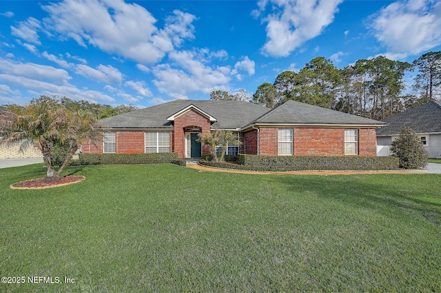 ranch-style home with a front lawn and brick siding