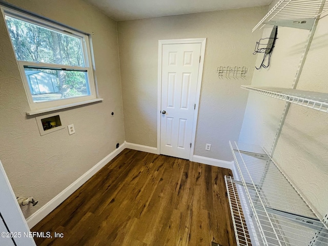 laundry area with hookup for a washing machine, electric dryer hookup, wood finished floors, laundry area, and baseboards