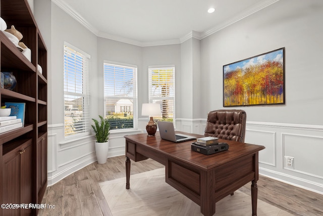 office with a wainscoted wall, recessed lighting, ornamental molding, a decorative wall, and light wood-type flooring