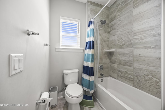 bathroom with toilet, baseboards, and shower / bath combo