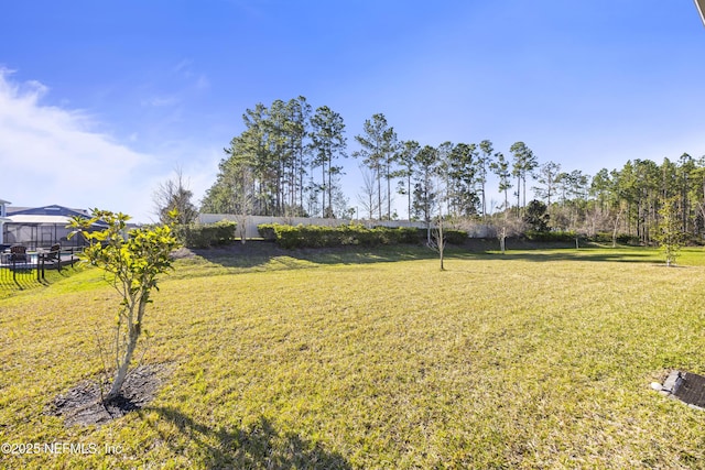 view of yard with fence