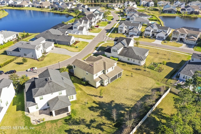 aerial view featuring a residential view and a water view