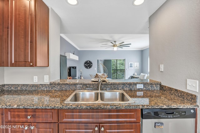 kitchen featuring a sink, a ceiling fan, ornamental molding, stainless steel dishwasher, and dark stone counters