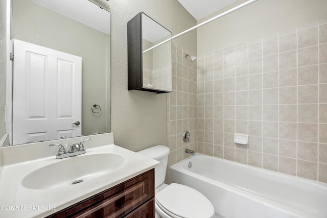 full bathroom with shower / bath combination, vanity, and toilet