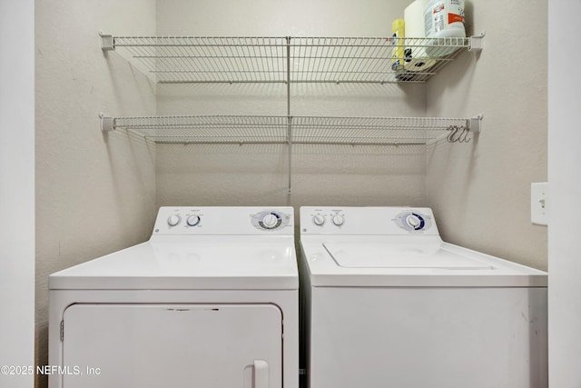 laundry room with washer and dryer and laundry area