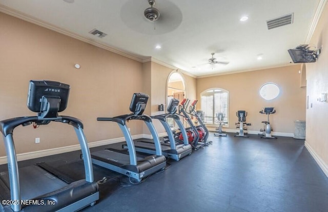 exercise room featuring baseboards, ceiling fan, visible vents, and crown molding