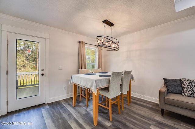 dining room with dark wood-style floors, baseboards, ornamental molding, and a textured ceiling