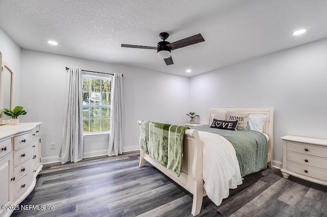 bedroom with dark wood-style flooring, recessed lighting, ceiling fan, a textured ceiling, and baseboards