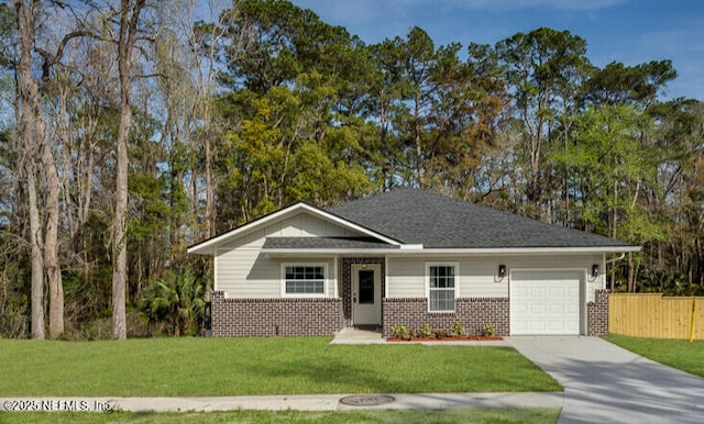 ranch-style house with a garage, brick siding, fence, concrete driveway, and a front lawn