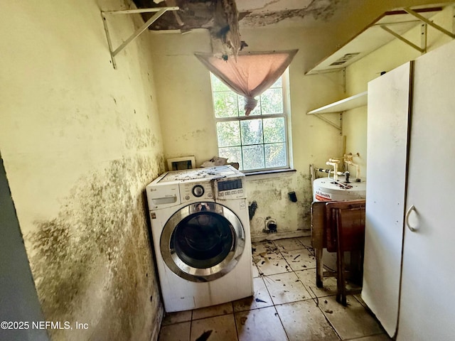 clothes washing area featuring laundry area and washer / clothes dryer