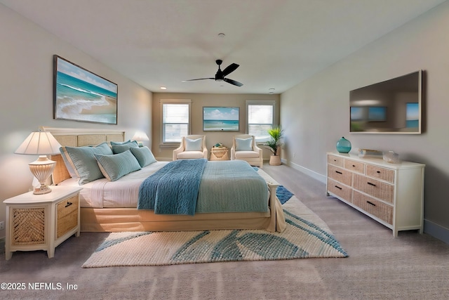 bedroom featuring a ceiling fan, carpet flooring, and baseboards