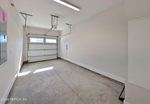 garage featuring baseboards and a garage door opener