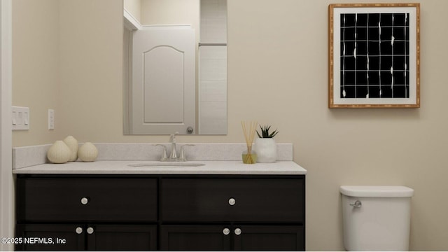 bathroom with toilet and vanity