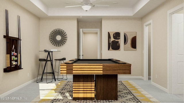 recreation room featuring billiards, baseboards, a raised ceiling, and light carpet