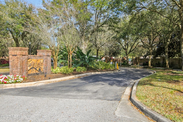 view of street with curbs and street lighting