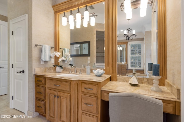 bathroom featuring ornamental molding, vanity, and an inviting chandelier