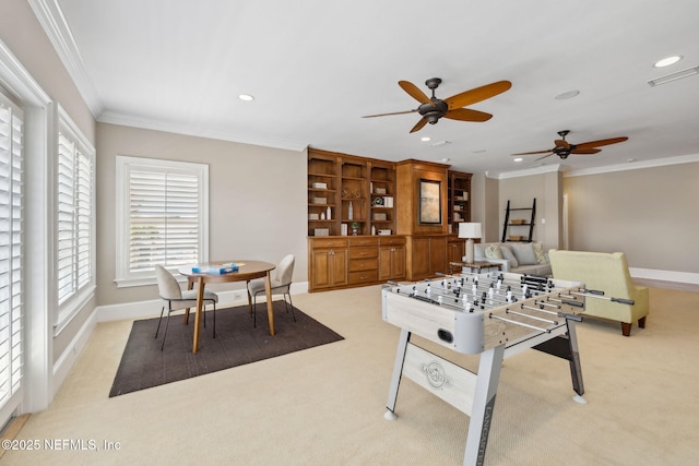 playroom with light carpet, visible vents, baseboards, ornamental molding, and recessed lighting