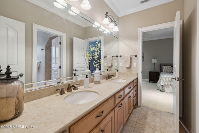 bathroom featuring ornamental molding, tile patterned floors, a sink, and double vanity